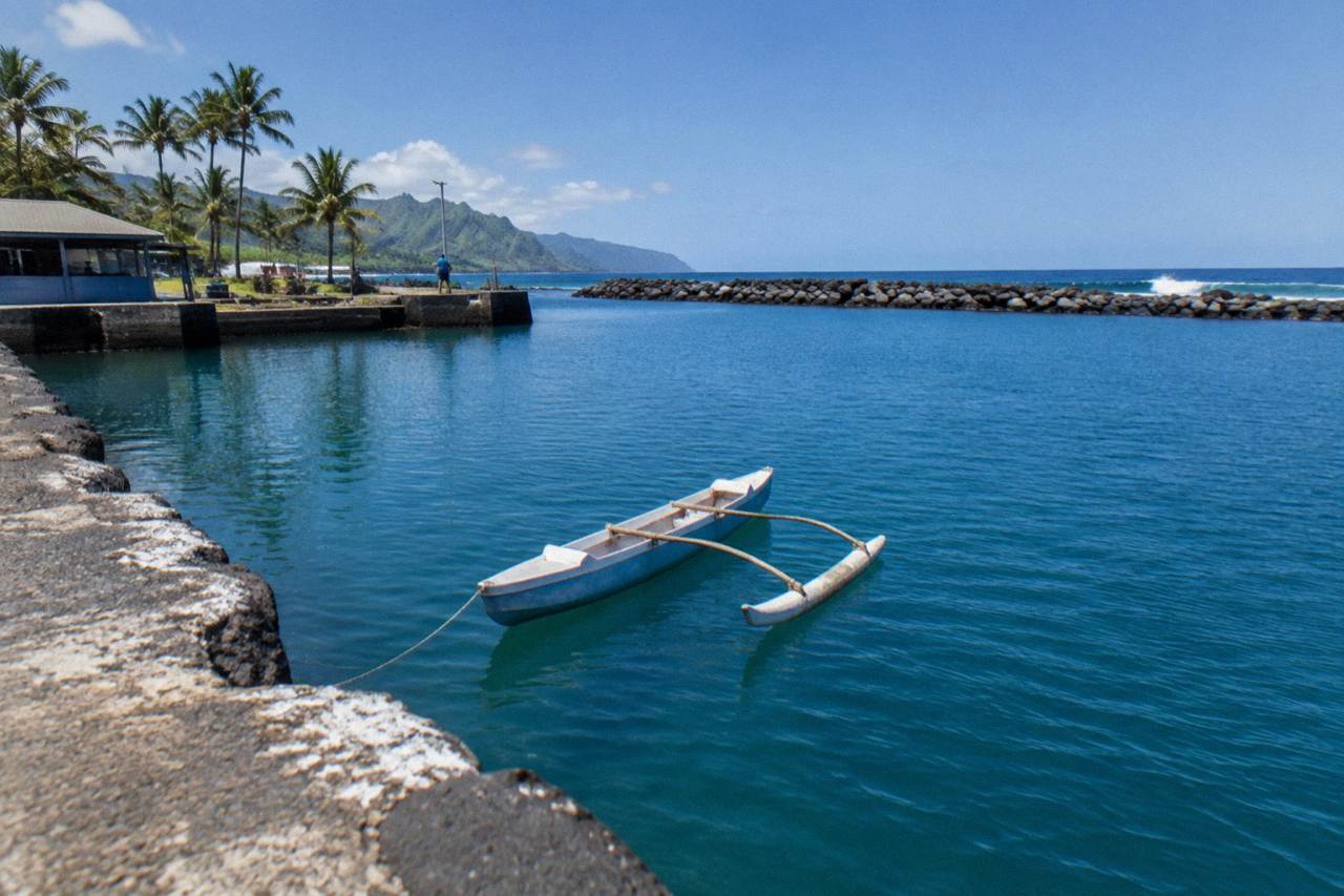 Open ocean water far from the Oahu coastline under a clear sky