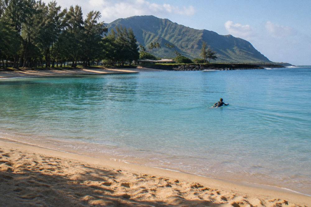 Calm turquoise open ocean surface on a clear morning off Oahu