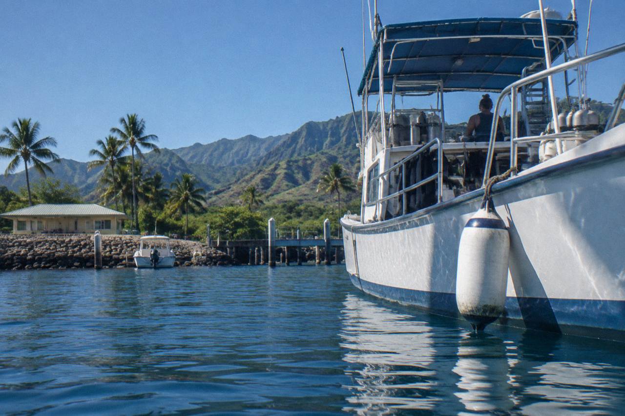 Clear blue open ocean water off the North Shore of Oahu near a moored dive boat
