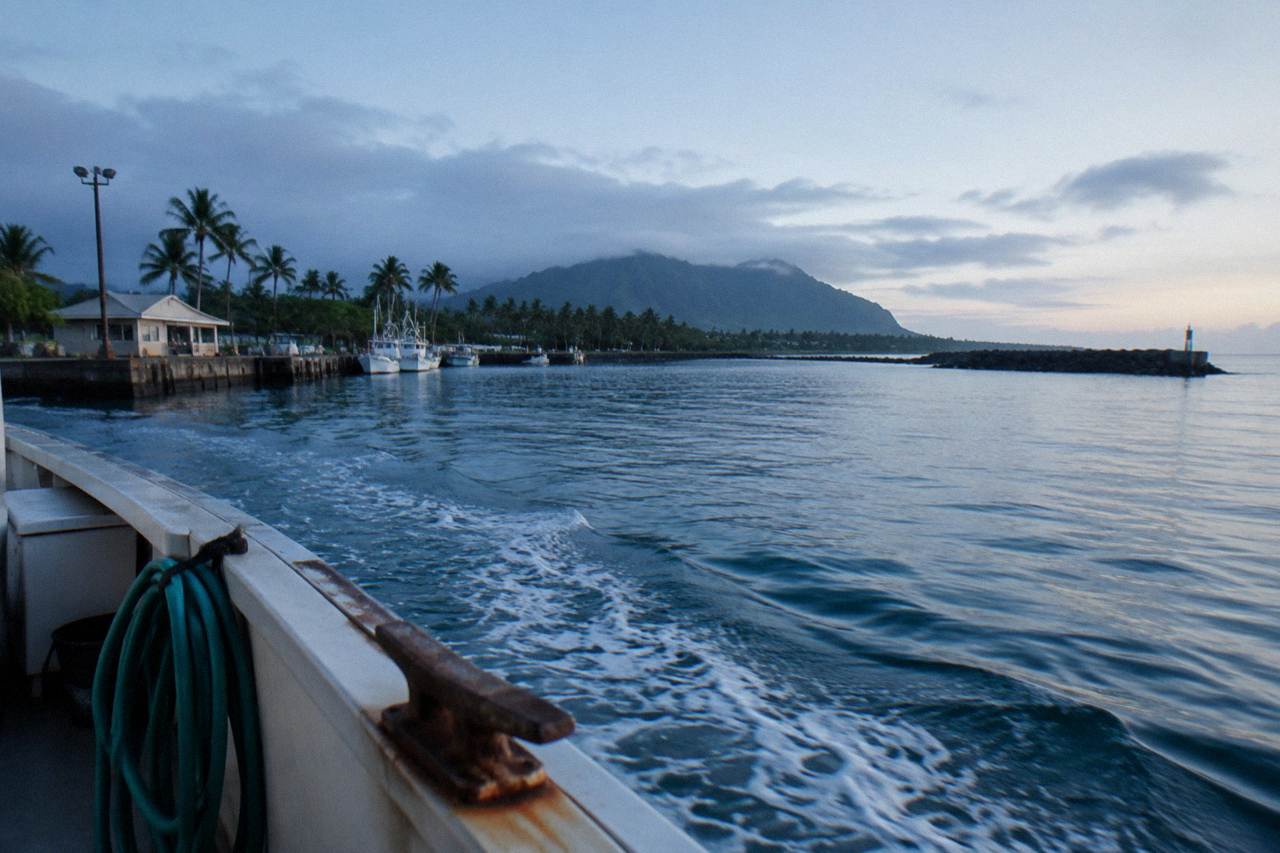 Open blue ocean surface seen from a boat rail far off the Oahu coast