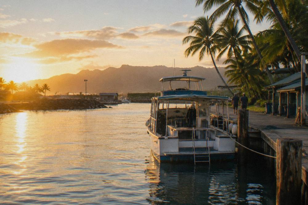 Tour boat at a dock in a small boat harbor on the North Shore of Oahu